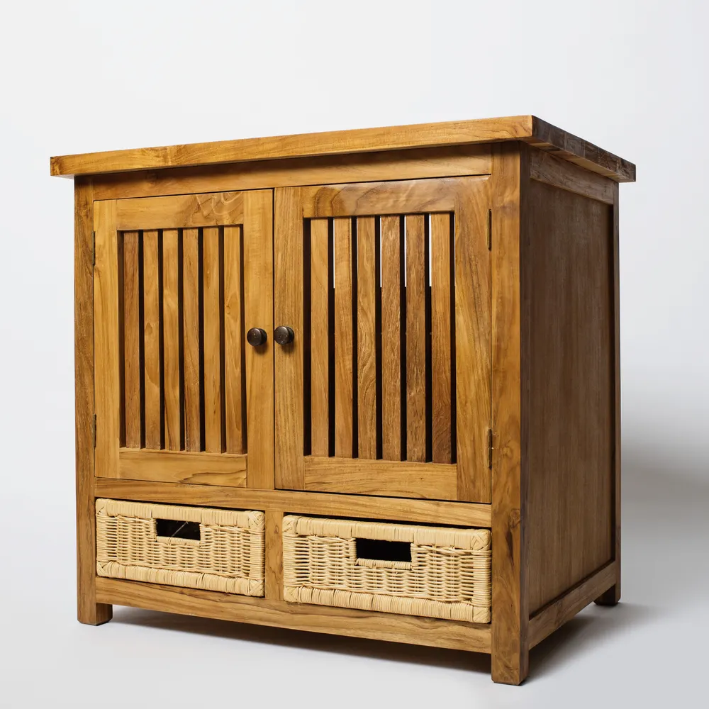 A teak cabinet with slatted doors and two woven rattan drawers
